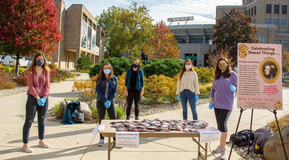 SWE members selling cookies during Ada Lovelace day.