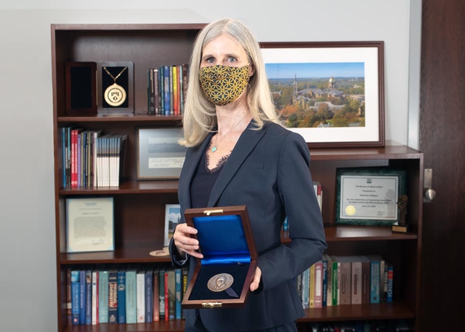 Patricia J. Culligan holding the H. Bolton Seed Medal