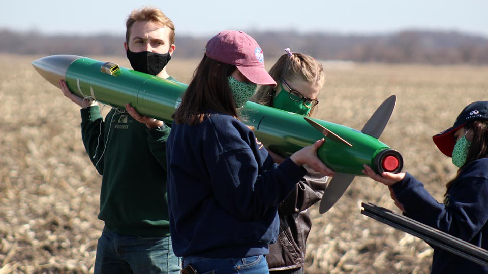 NDRT members inspecting their rocket