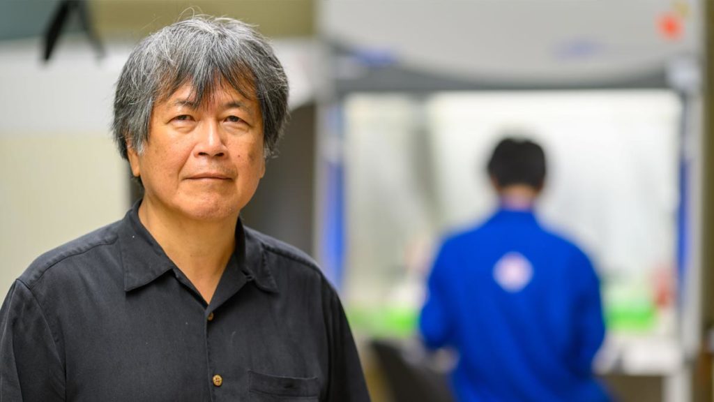 Hsueh-Chia Chang in lab, grad student in background