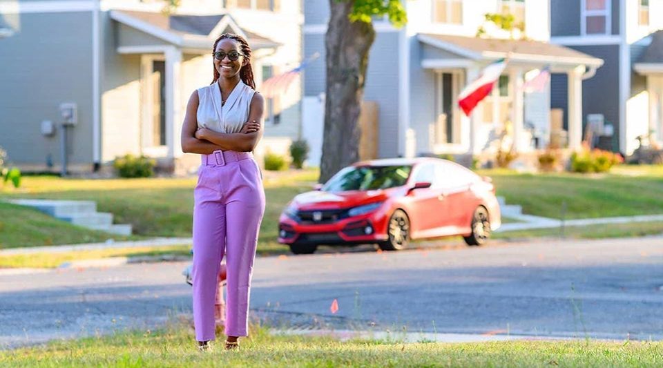 Angelique Mbabazi stands near the intersection of Dayton and Carroll streets in South Bend