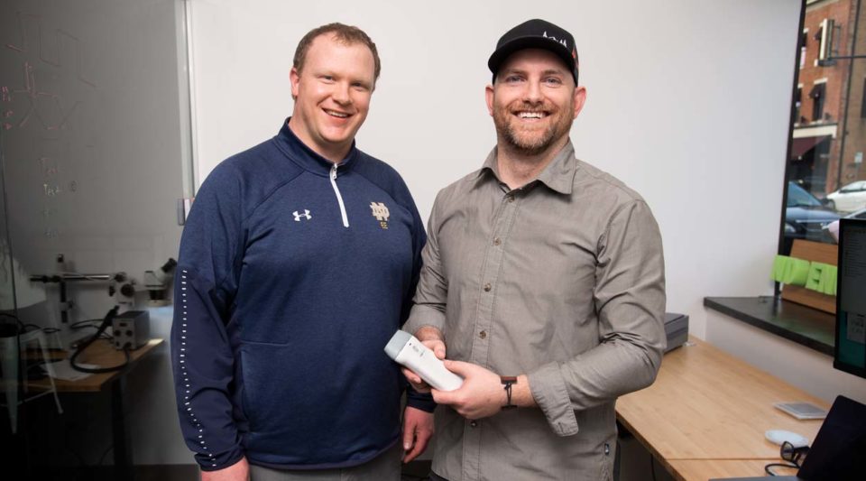 Tom O’Sullivan and Roy Stillwell holding the NearWave device