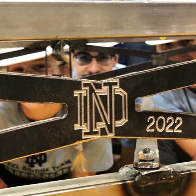 ND students looking through part of their bridge that has ND 2022 on it