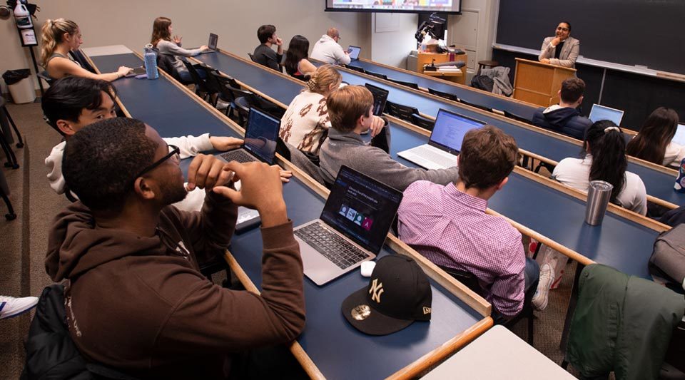 Prof. Kumar teaching in front of a class